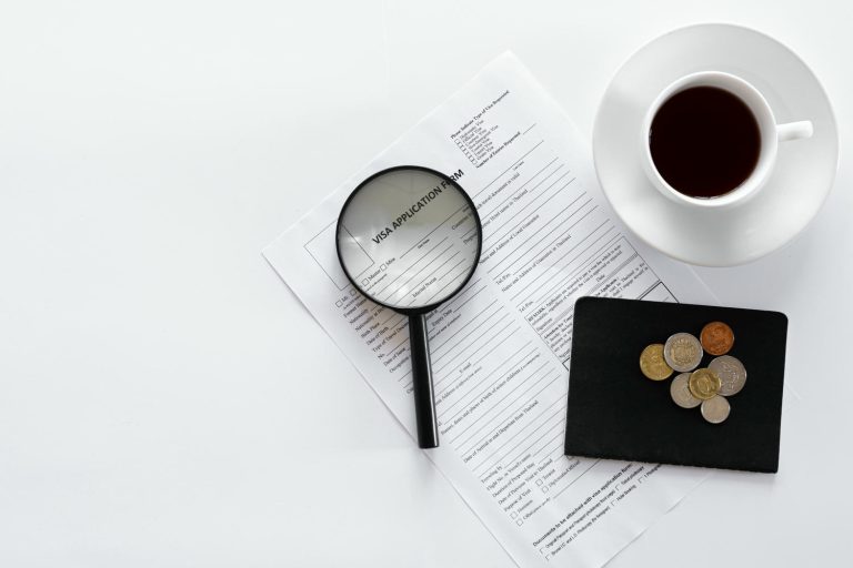 visa-application-form-documents-cup-coffee-white-background